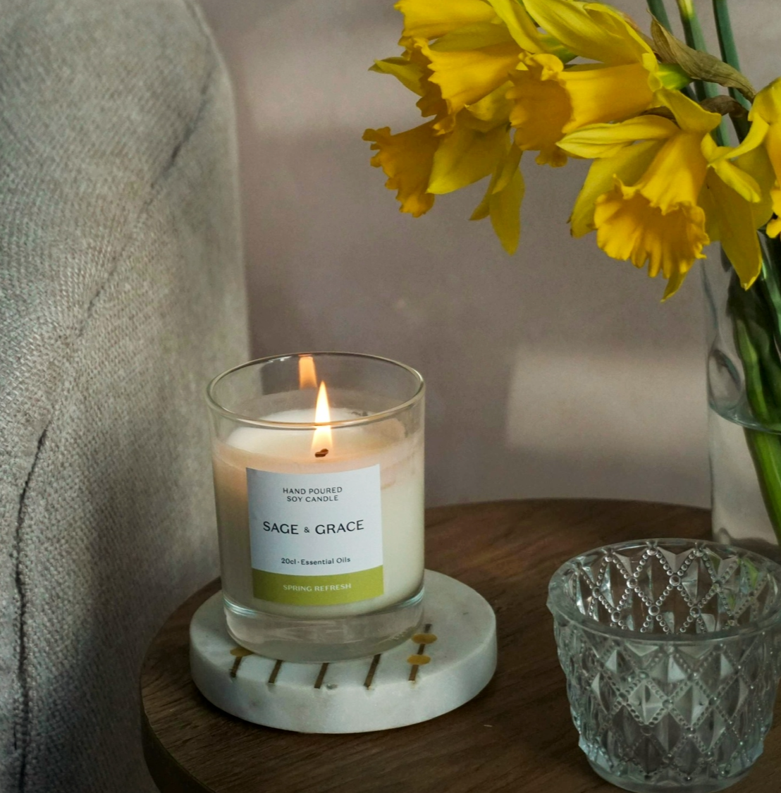 Essential oil candles positioned in a light wooden box