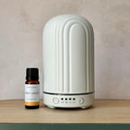 Ceramic ribbed white electric diffuser and a Sage & Grace essential oil blend